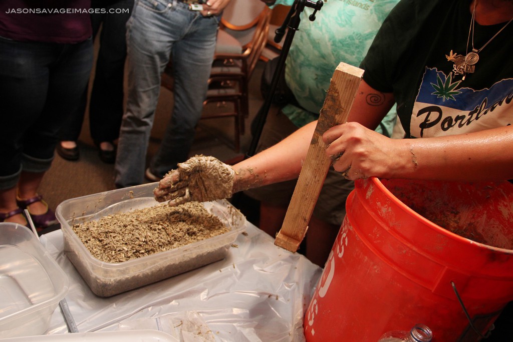 When she was finished tamping it down, you can see that the center is a bit more elevated than the edges - this is desirable and is the proper tamping technique.