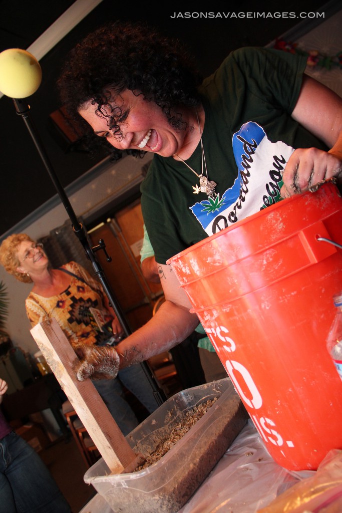 Then you can begin putting the hemp mixture into the form and tamping it down. Joy explained it was important to only tamp the edges to ensure that the walls maintained their breathability and also to ensure that you didn't use too much material.